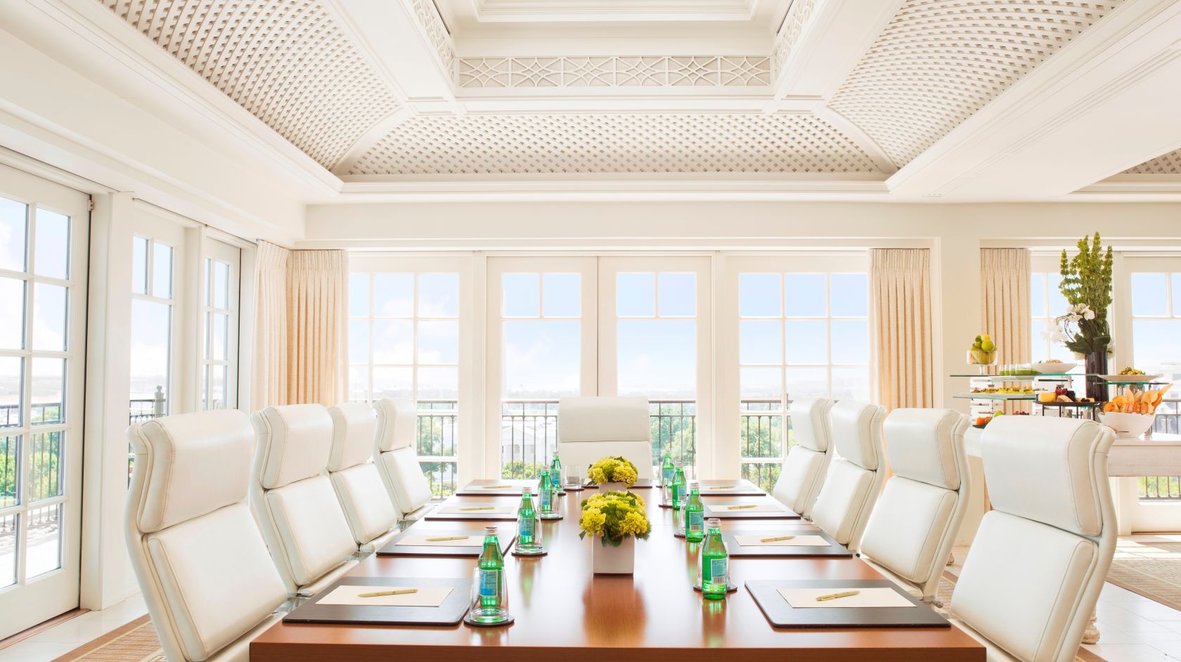 John Adams meeting room in The Hay-Adams Hotel with Washington DC views and white leather chairs surrounding a set wooden board table