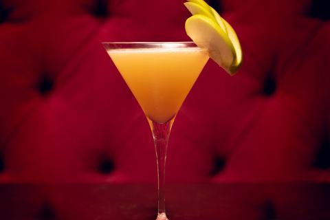 A pear martini sitting on a table